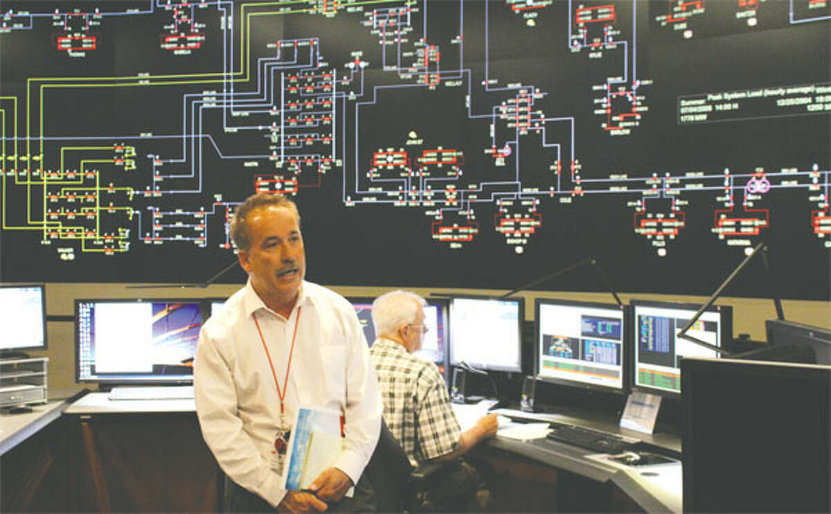 A large screen in United Illuminating’s Orange headquarters, showing a simulated image during a media tour, allows the company to monitor the flow of electricity to Shelton and the 16 other towns it serves. (Photo by John Kovach)
