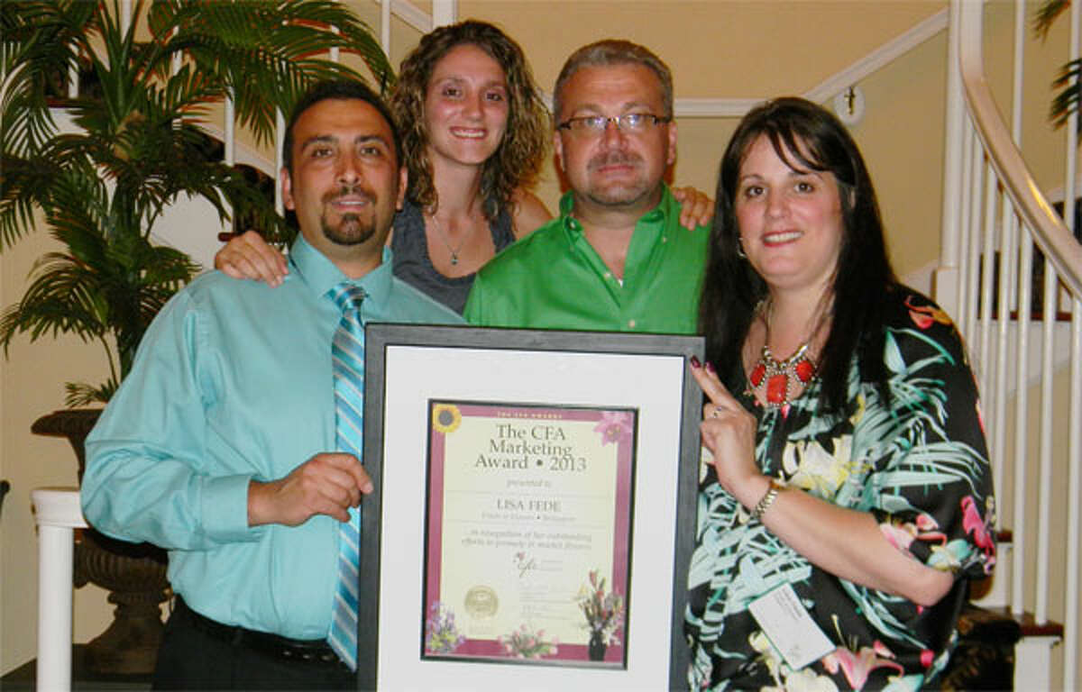 Holding the Connecticut Florists Association award from the Fruits & Flowers shop are, from left, Nello Fede, Jessica Minotti, Lee Reiske and Shelton resident Lisa Fede. Fruits & Flowers is at 566 Lindley St. in Bridgeport’s North End.