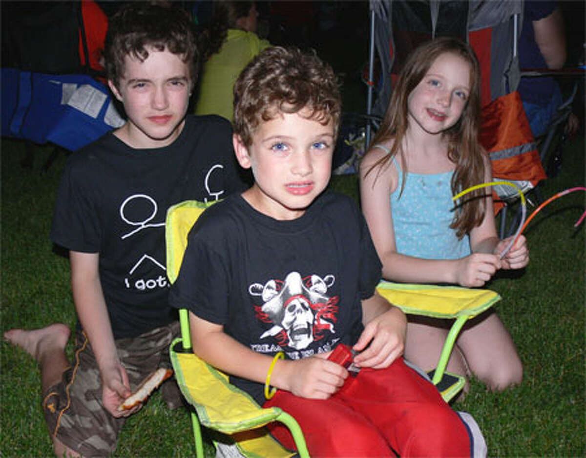 Ready for the nighttime sky to be lit up are the Scali siblings of Shelton, from left, Gavin, 11; Colin, 6; and Maura, 9. (Photo by Brad Durrell)