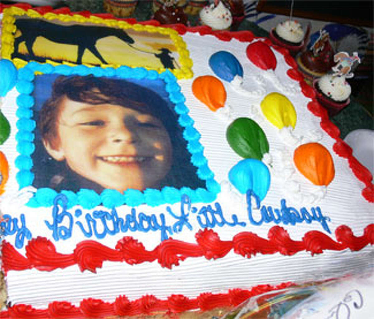 A birthday cake for the late Jesse Lewis at the 2013 SHS '81 fund-raising event with the message, “Happy Birthday Little Cowboy.”