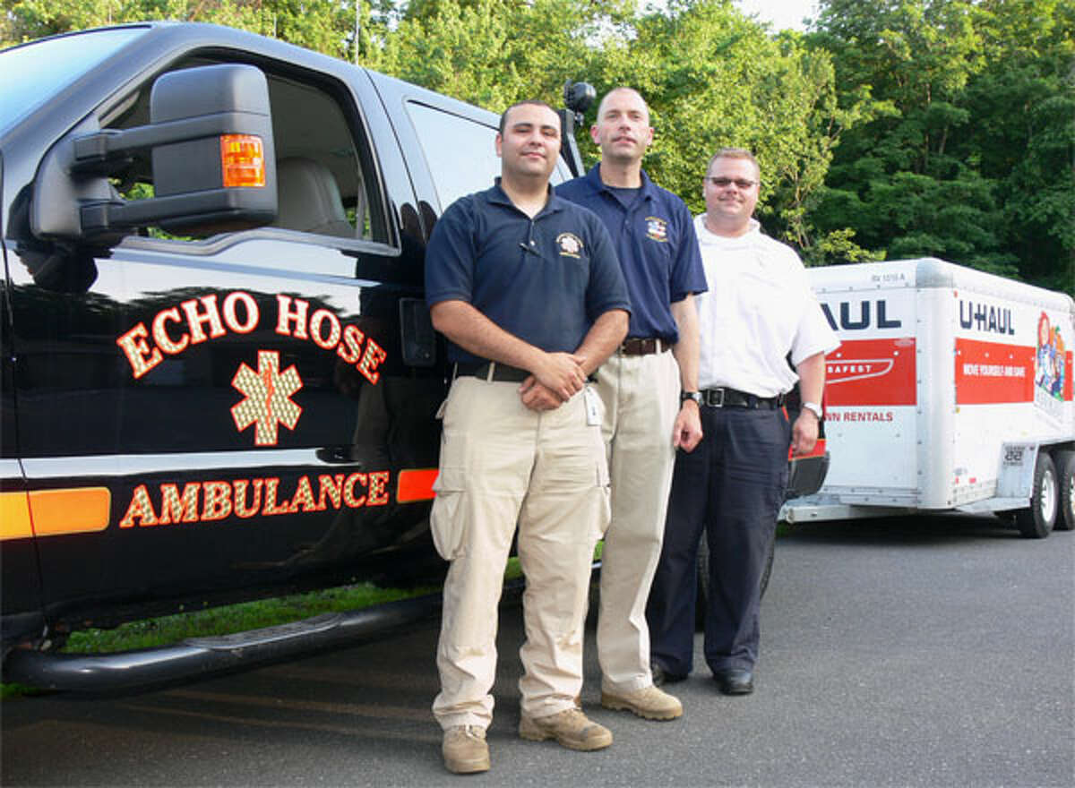 Echo Hose Ambulance Volunteer Corps members Jeff Caporaso, left, and Tim Greer, center, with Chief Mike Chaffee before they begin a three-day mission to assist tornado first responders and victims in Oklahoma.