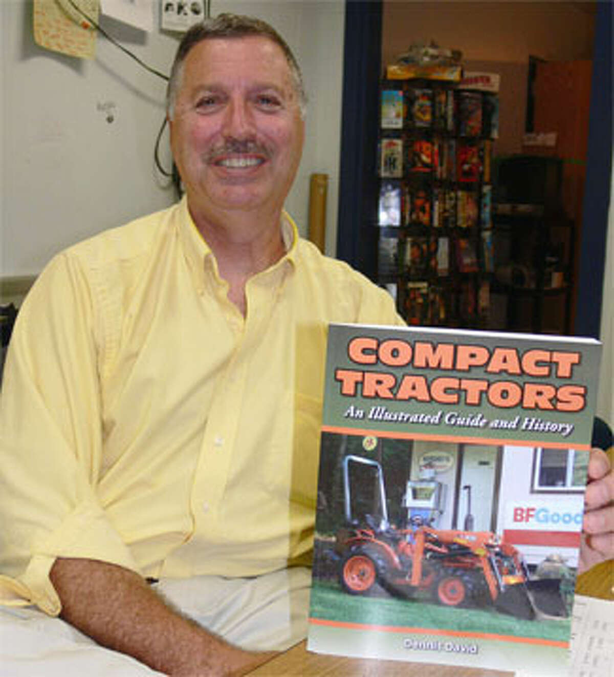 Dennis David, a technology teacher at Shelton Intermediate School, has written a new book about compact tractors.