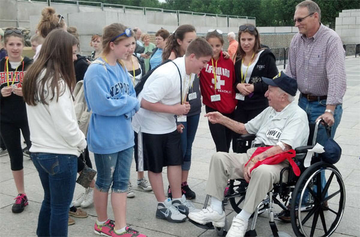 A group of Shelton Intermediate School students thank a veteran for his service at the World War II Memorial while on a field trip to Washington, D.C.