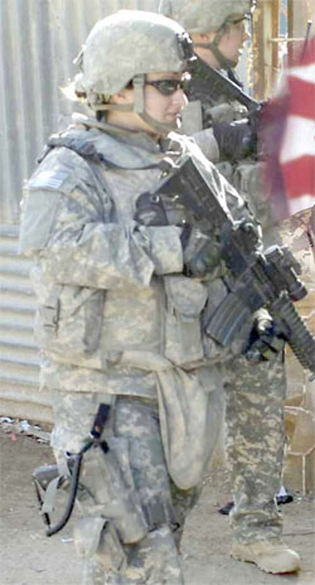 Like many veterans, Shelton resident Lauren Cust, shown on patrol in Iraq, has faced challenges in re-adjusting to civilian life.