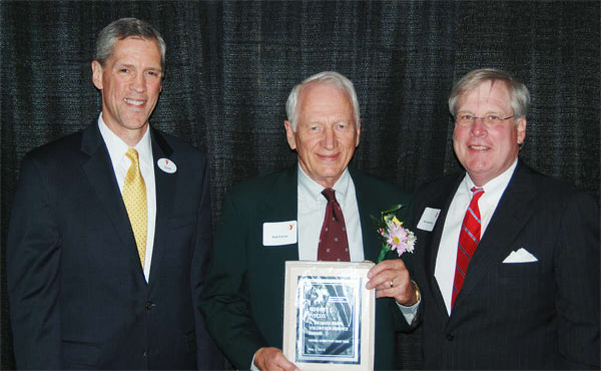 Shelton resident Robert L. Fiscus, center, the 2013 H. Richard Brew Volunteer Service Award recipient, with David Stevenson, left, Central Connecticut Coast YMCA CEO, and Jon Leckerling, board of trustees chairman.