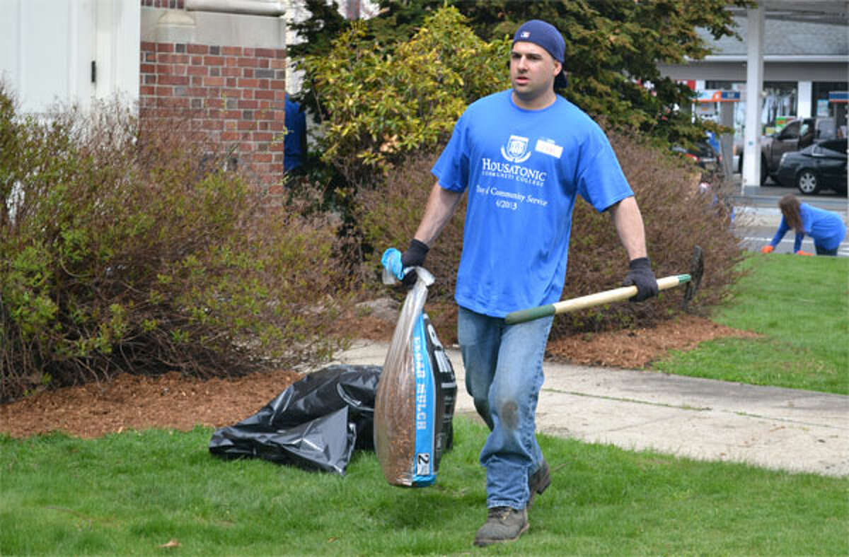 Housatonic Community College student John Puglisi was one of many volunteers who pitched in with landscaping at Bridgeport’s United Congregational Church during the HCC Day of Community Service.