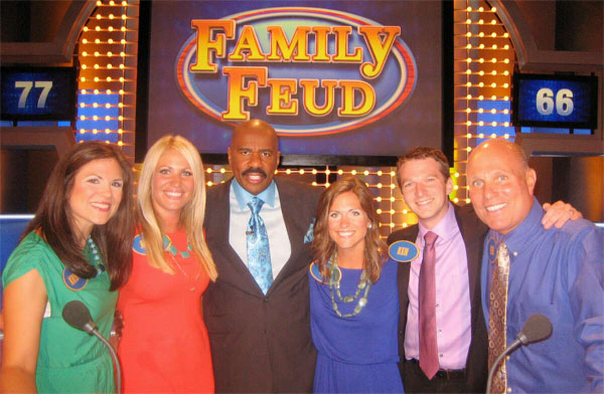 With “Family Feud” host Steve Harvey (third from left) are members of the Baldyga family of Shelton, from left, Kristen, her sister Kellie, her sister Kim, her husband Ken, and her father Ken.