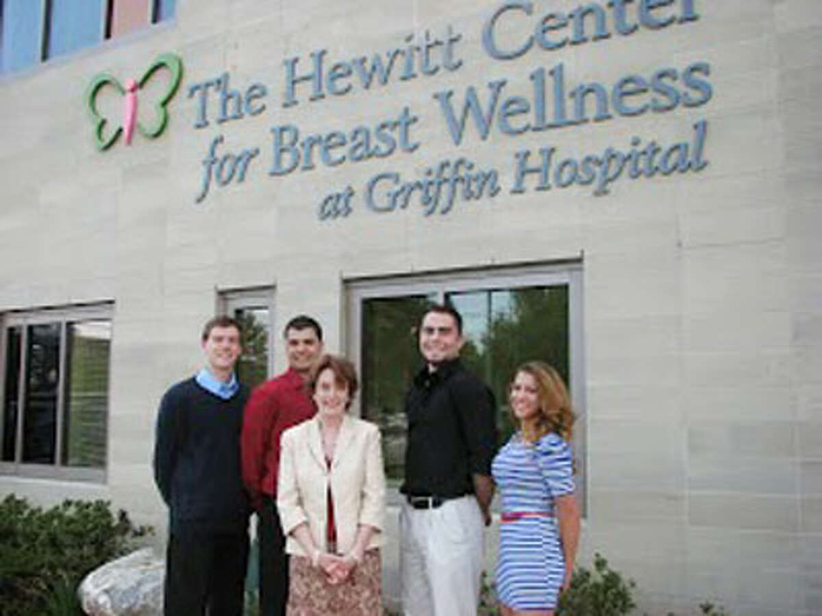 Presenting a donation from the Shelton High boys volleyball team to Griffin Hospital Development Fund Executive Director Cornelia Evans, center, are, from left, John Kocur, Michael Torres, Mac Thompson and Emma Hanrahan.