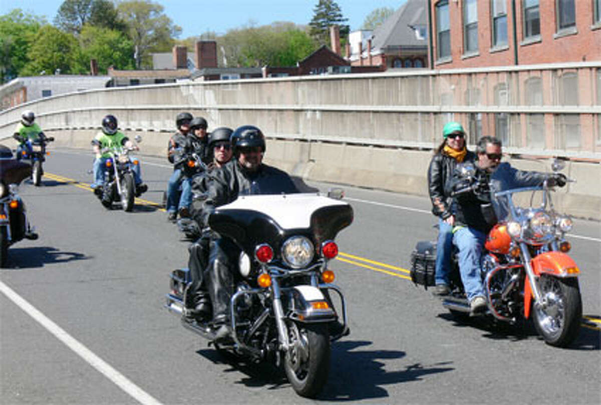 Motorcyclists in the Green Ribbon Ride travel on Bridge Street in Shelton, with the Birmingham condominium complex in the background. (Photo by Brad Durrell)