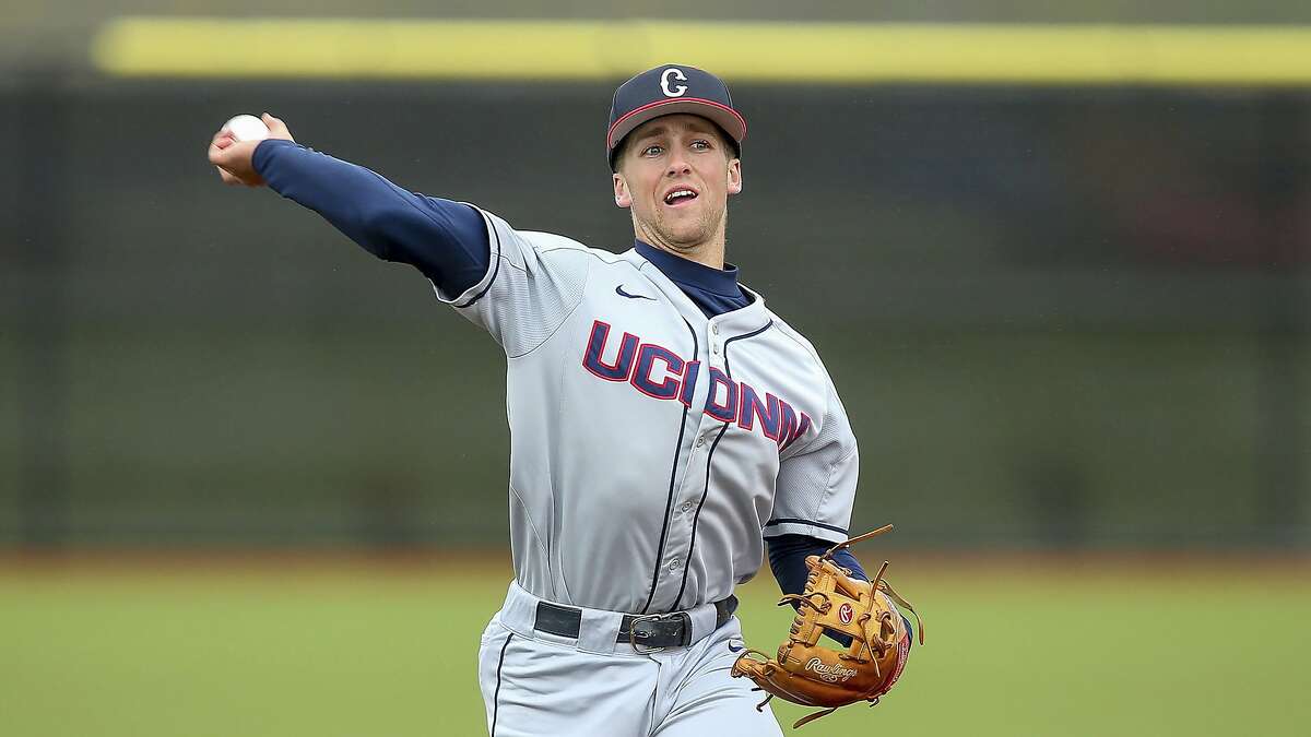 Connecticut's Michael Woodworth throws the ball during an NCAA college baseball game against Rhode Island, Tuesday, May 14, 2019, in Kingston, R.I. (AP Photo/Stew Milne)