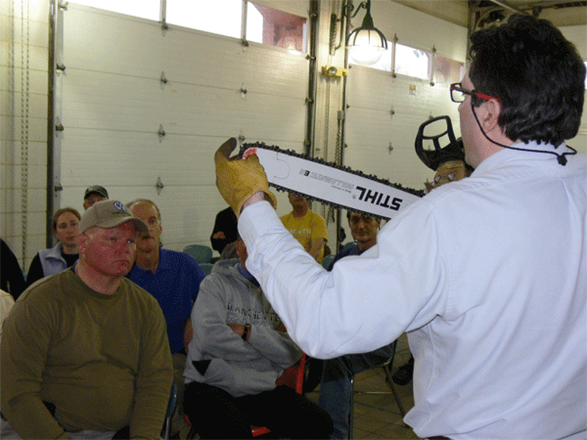 Stihl representative Andrew Krenz discusses how a chainsaw works during the class in Shelton.