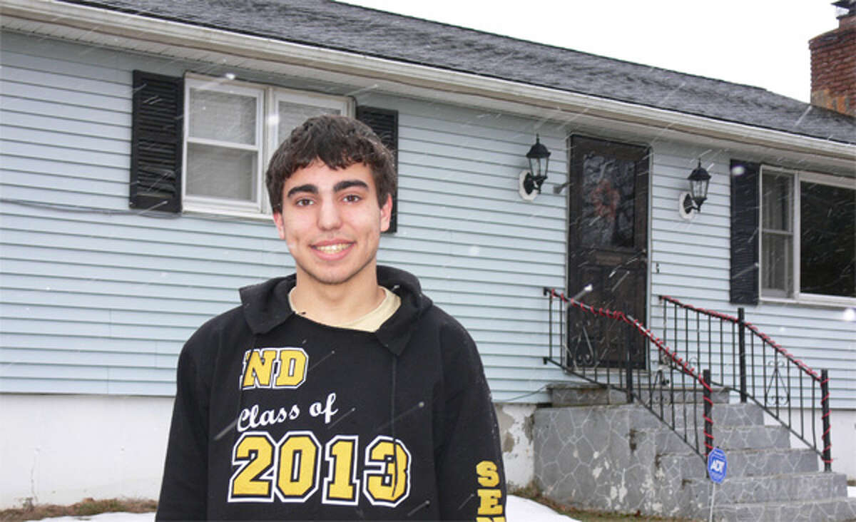 Taylor Chavez of Shelton, a senior at Notre Dame High School in Fairfield, in front of his family home.