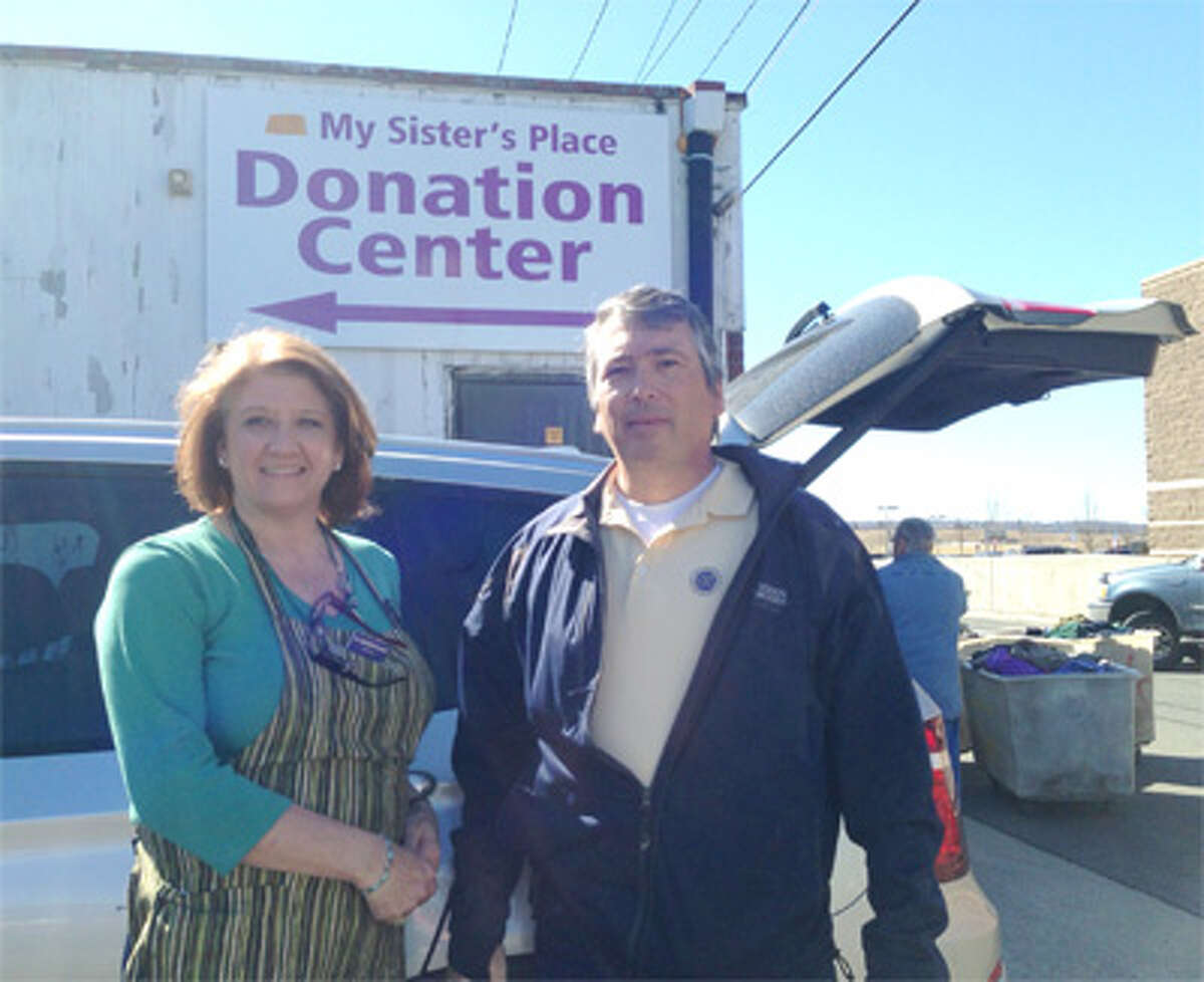 Shelton Exchange Club member Tom Christiano drops off donations for My Sister's Place with the help of Christine Boulay, the thrift store’s donations coordinator.
