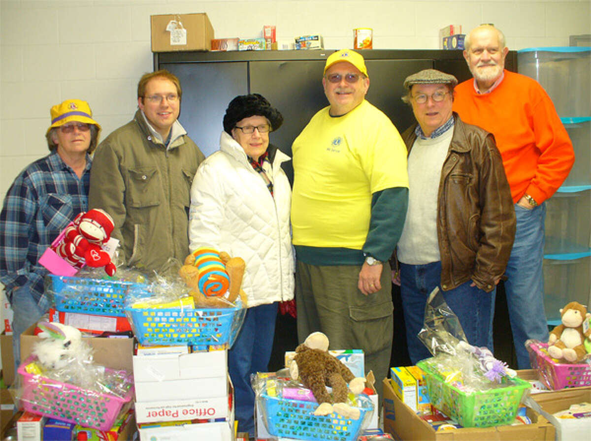 Shelton Community Lions Club members with the Easter gift baskets.