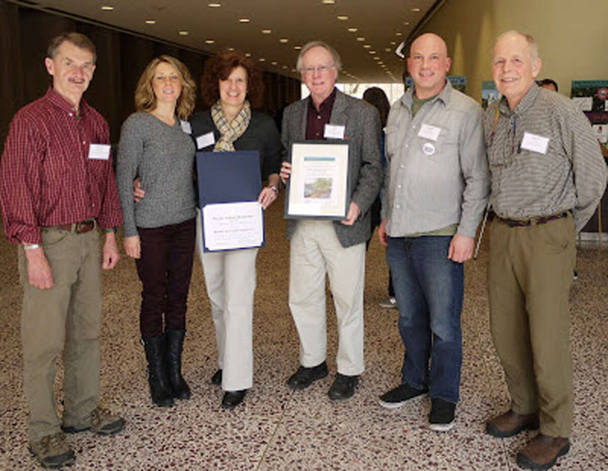 Accepting the 2013 Excellence in Conservation Award are Rich Skudlarek, Sandie Kopac, Sheri Dutkanicz, Bill Dyer, Joe Welsh and Bruce Nichols. This photo was taken by Teresa Gallagher, city conservation agent, who prepared and submitted the application that led to the statewide award.