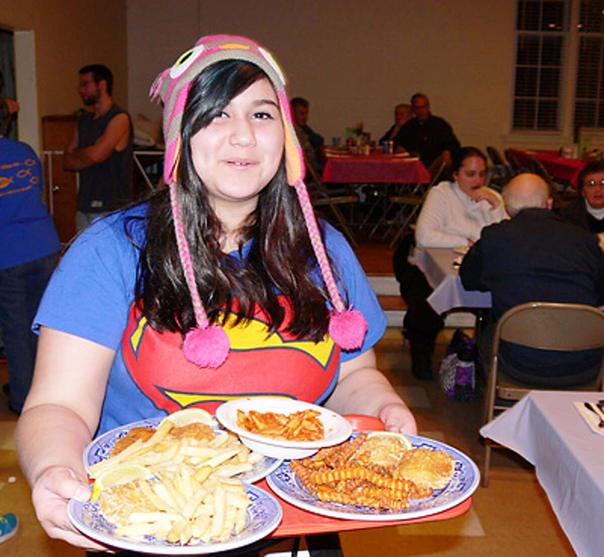 Ximenita Varas volunteers as a meal server during a past Lenten Fish Fry at United Methodist..