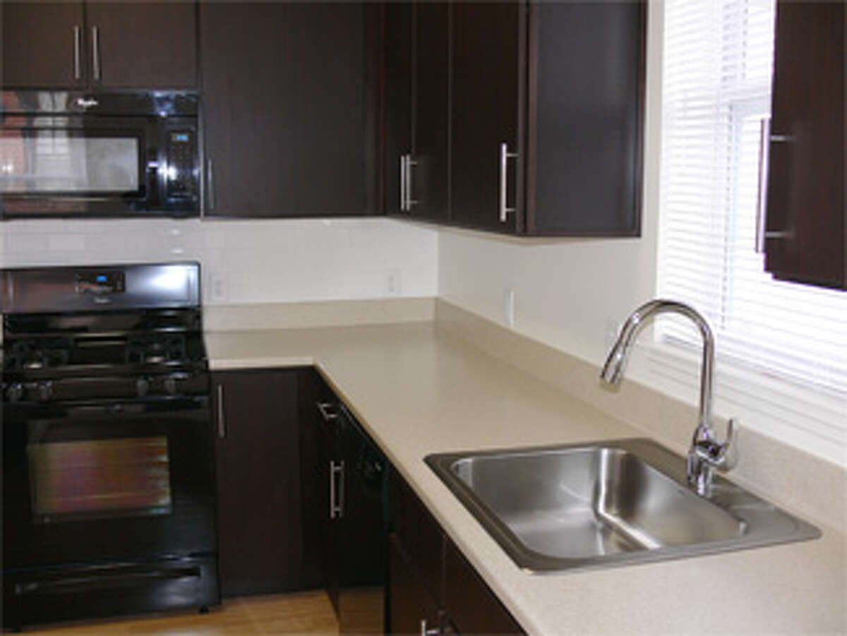 Part of the kitchen inside a two-bedroom unit available to be rented.