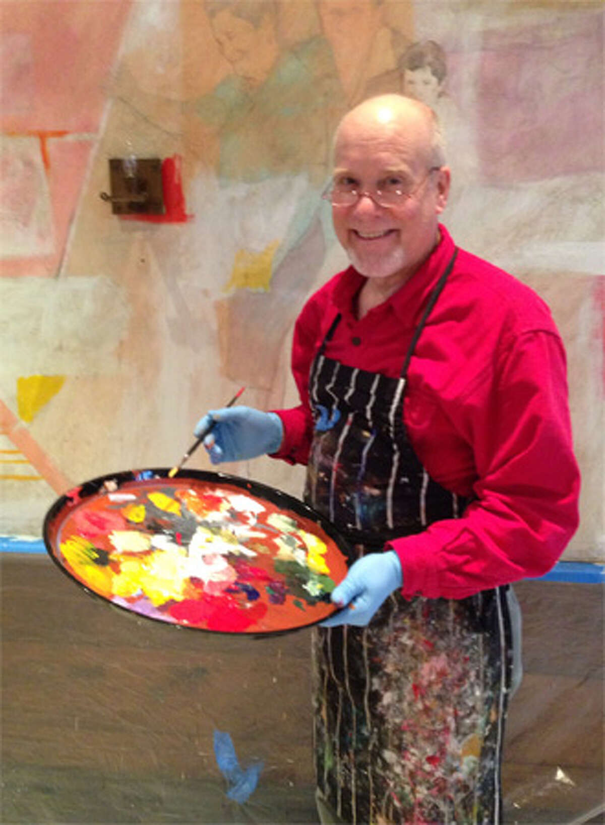 Artist and craftsman Tom Masaryk works on a contemporary mural for Il Palio’s dining room in Shelton using images from executive chef Margherita Aloi’s life story.