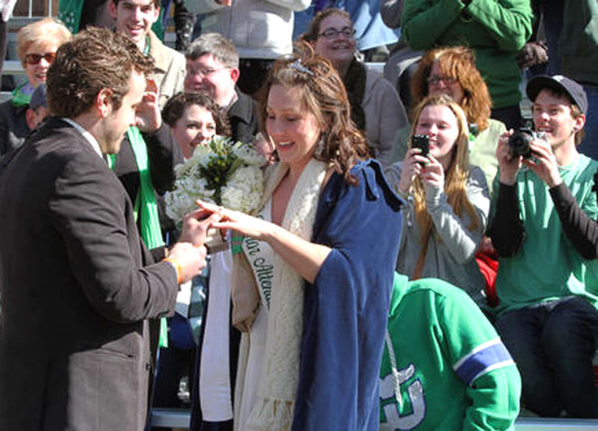 Dan Carr places an engagement ring on the finger of Kate Thompson of Shelton at the New Haven St. Patrick’s Day parade.