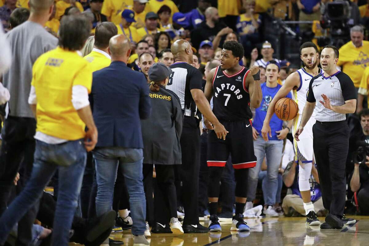 OAKLAND, CALIFORNIA - JUNE 05: Kyle Lowry #7 of the Toronto Raptors complains to referee Marc Davis #8 against the Golden State Warriors in the second half during Game Three of the 2019 NBA Finals at ORACLE Arena on June 05, 2019 in Oakland, California. NOTE TO USER: User expressly acknowledges and agrees that, by downloading and or using this photograph, User is consenting to the terms and conditions of the Getty Images License Agreement. (Photo by Ezra Shaw/Getty Images)