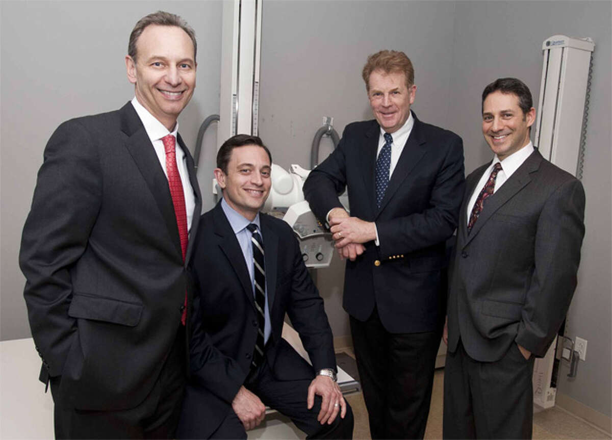 Shown, from left, are Dr. Tedd L. Weisman of OrthopedicHealth, Dr. Aaron K. Schachter of OrthopedicHealth, Glenn Elias, CEO of Connecticut Orthopaedic Specialists, and Dr. Amit Lahav of OrthopedicHealth.