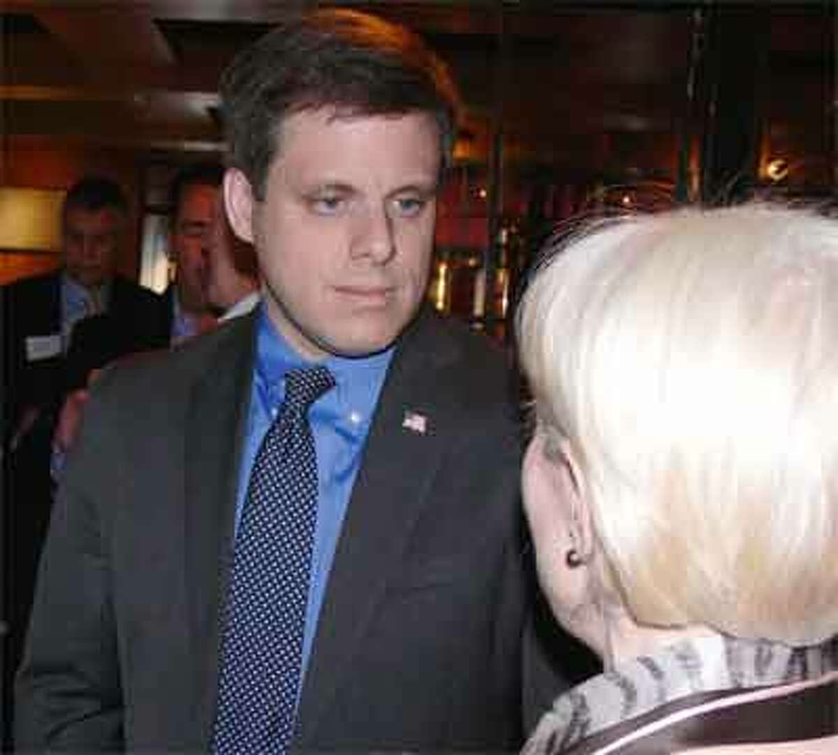 Dan Debicella of Shelton talks to a supporter at a recent campaign event to boost his congressional run.