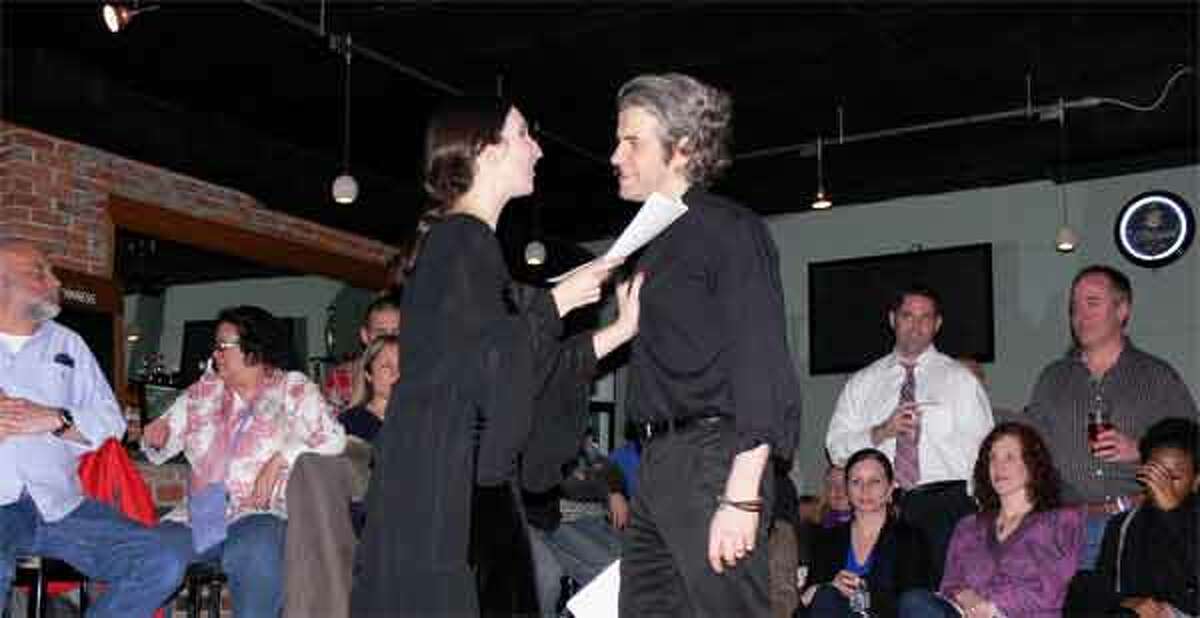Actors Sarah Ann Masse and Nick Afka Thomas, who are married in real life, perform for the audience.