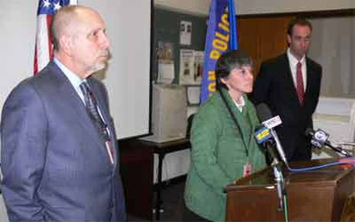 Beth Smith, Shelton High School headmaster, center, speaks at a press conference on Monday morning. On the left is Shelton School Supt. Freeman Burr and on the right, behind her, is Shelton Police Lt. Robert Kozlowsky.