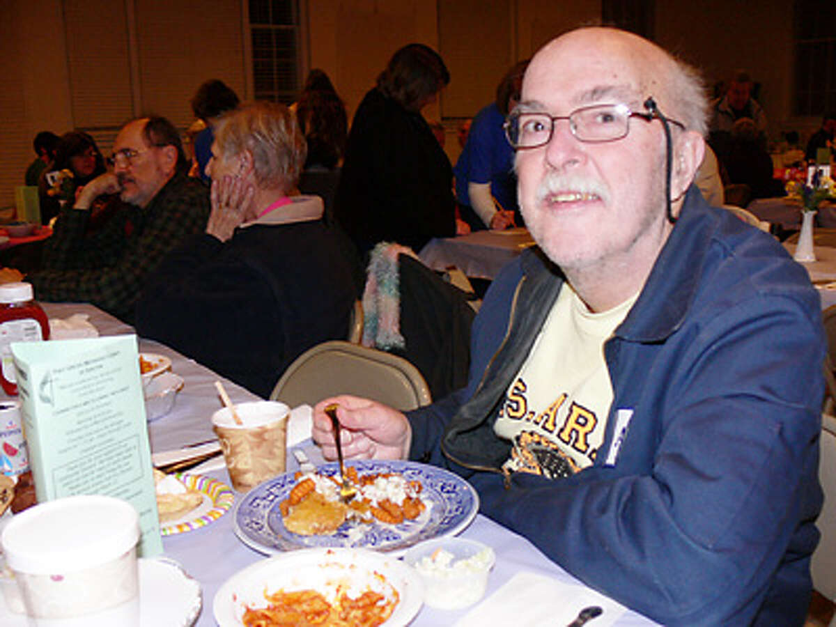Jim Capinera of Shelton enjoys his meal while at a fish fry dinner last year at First United Methodist Church.