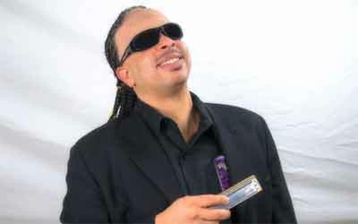 Gabriel Bello, above, performs as Stevie Wonder with a tribute band.