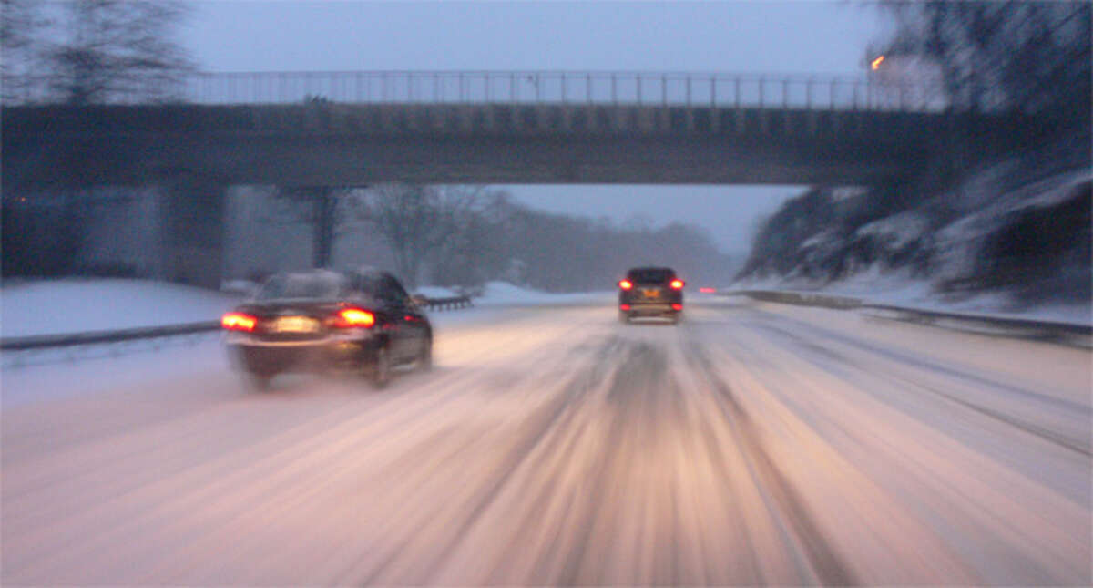 Cars travel south on Route 8 in Shelton on Friday morning.