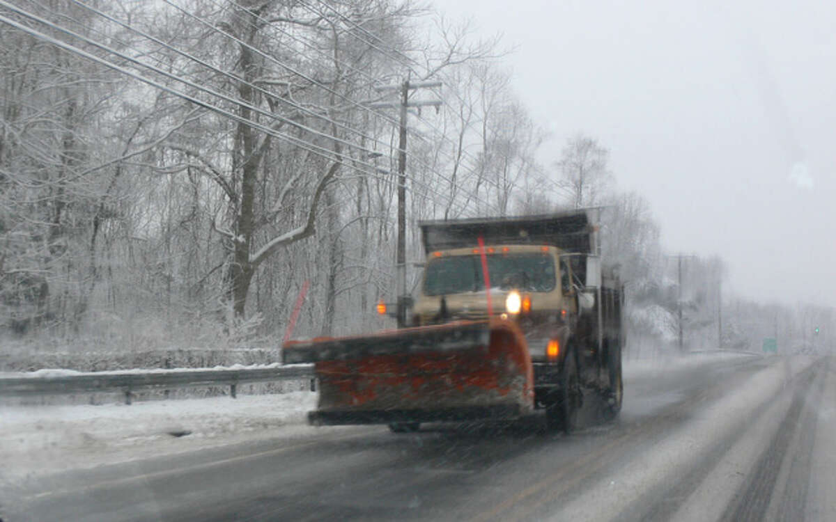 A snowplow travels on Bridgeport Avenue in Shelton.