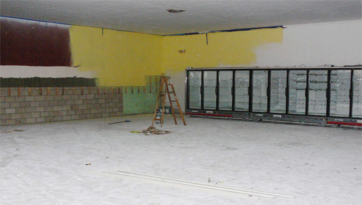 The inside of the former Beechwood Market has essentially been stripped to make way for new fixtures, such as the installed refrigerator and freezer units shown in the rear.