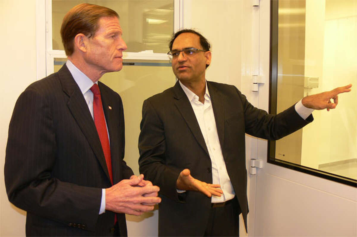 U.S. Sen. Richard Blumenthal, left, and Anil R. Diwan, president of NanoViricides Inc., discuss the company’s research into finding an Ebola treatment during a tour of its Shelton facility.