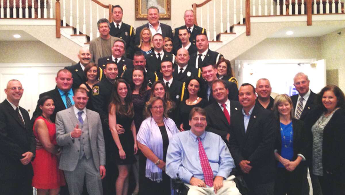 Shelton firefighters, friends, family, city officials and local Exchange Club members at the statewide Salute to Connecticut's Bravest event, where 12 Shelton fire personnel were honored.