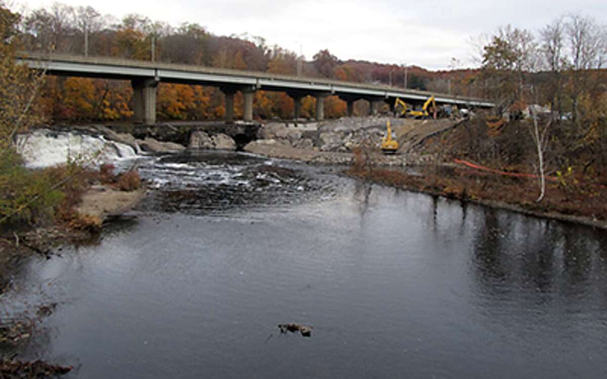 The Naugatuck River flows 40 miles in Connecticut, from Winchester to Derby.