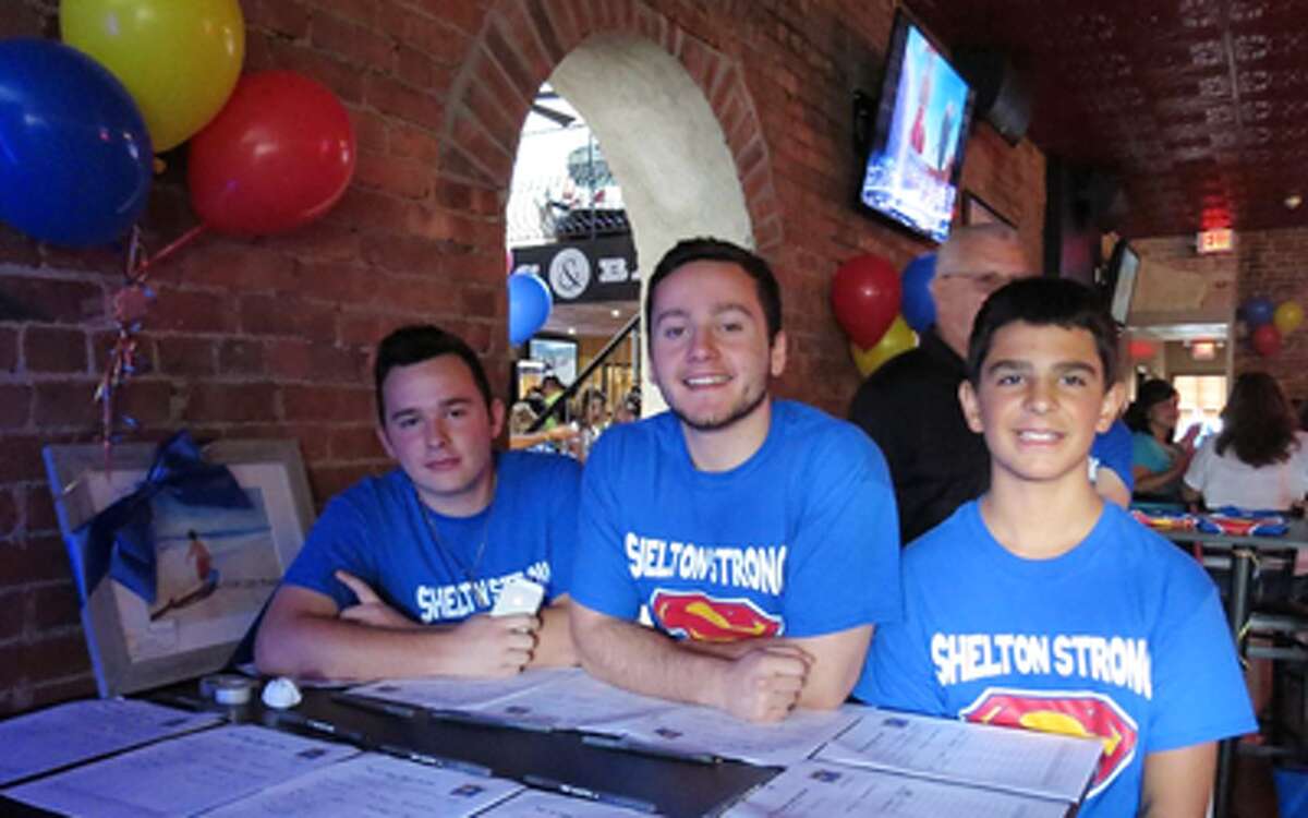 Attendees at an earlier event in Shelton to help young