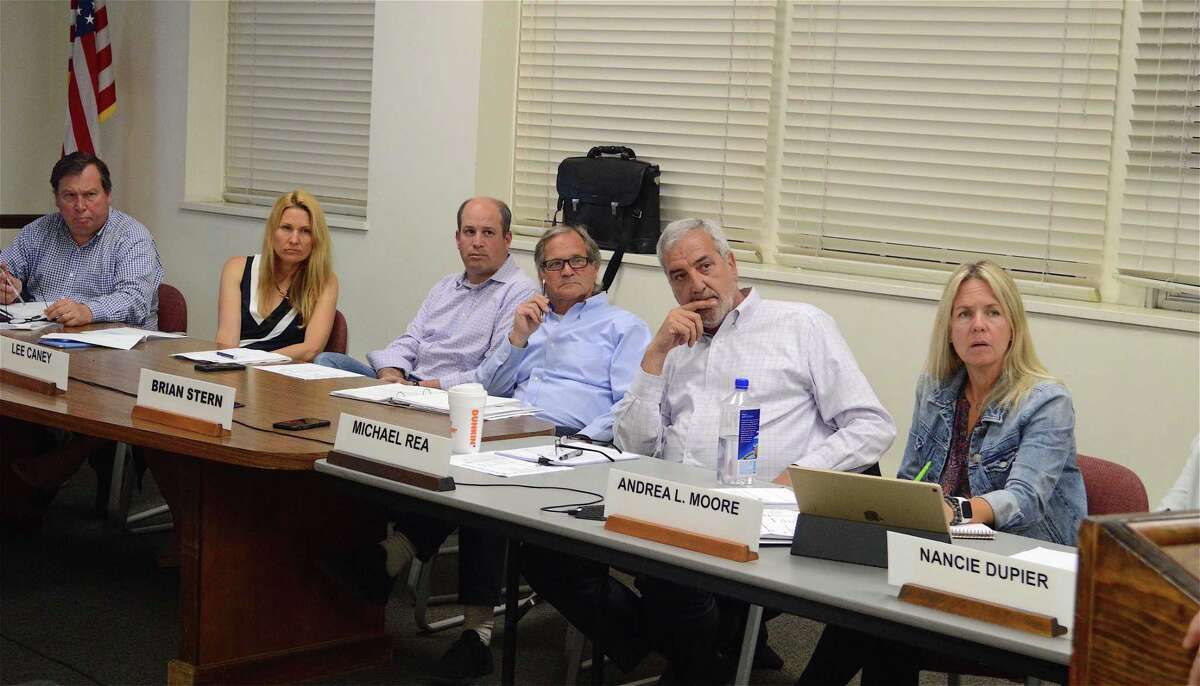 Board of Finance members listen to Mark Mathias, chairman of the Board of Education, explain the state of things regarding CMS, Wednesday night, June 5, 2019, in Westport, Conn.