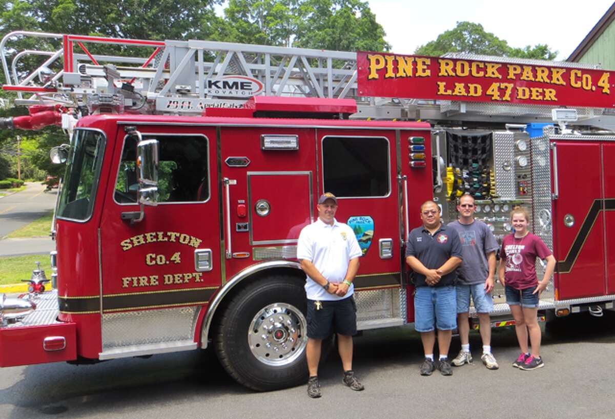 From left, Pine Rock Park Fire Company Asst. Chief Nick Verdicchio, Capt. Carlos Chang, 2nd Lt. Jack Brand and Abby Brand stand beside the company’s newest piece of equipment, Ladder 47.