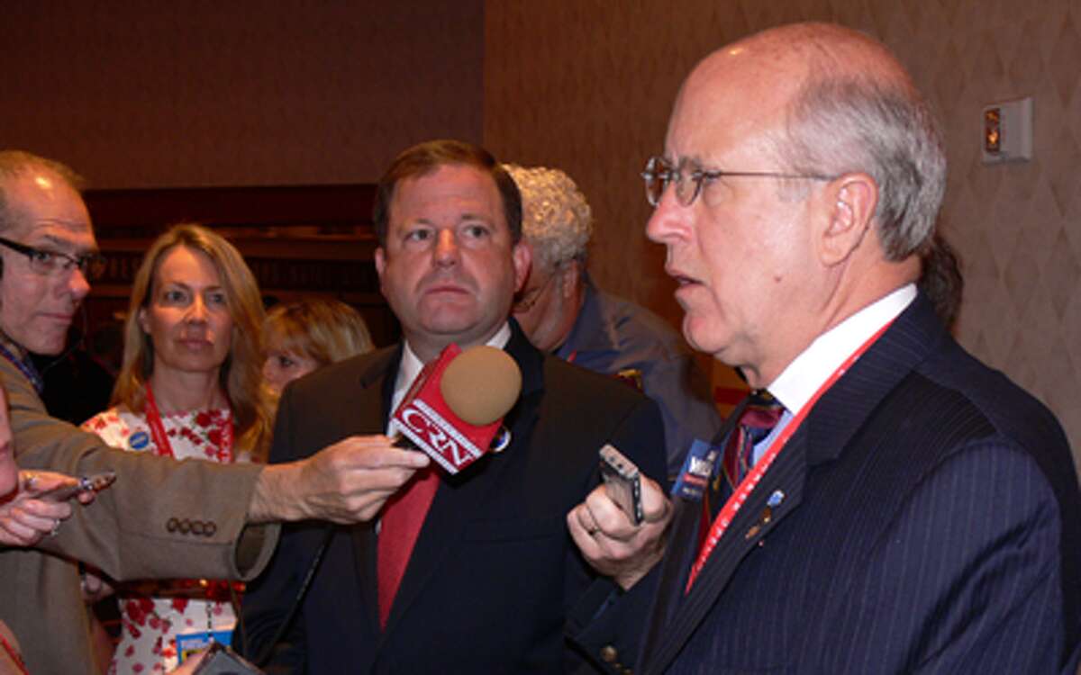 Dave Walker, right, talks to the press at the Republican State Convention in May. To the left of Walker is gubernatorial candidate John McKinney.