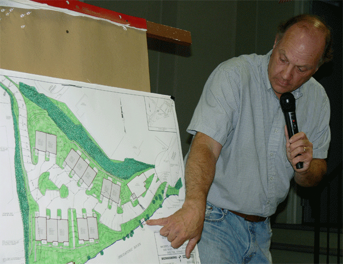 Peter Hughes, a land-use planner for the applicant, discusses a 14-unit condominium and small marina proposed for 500 River Road.