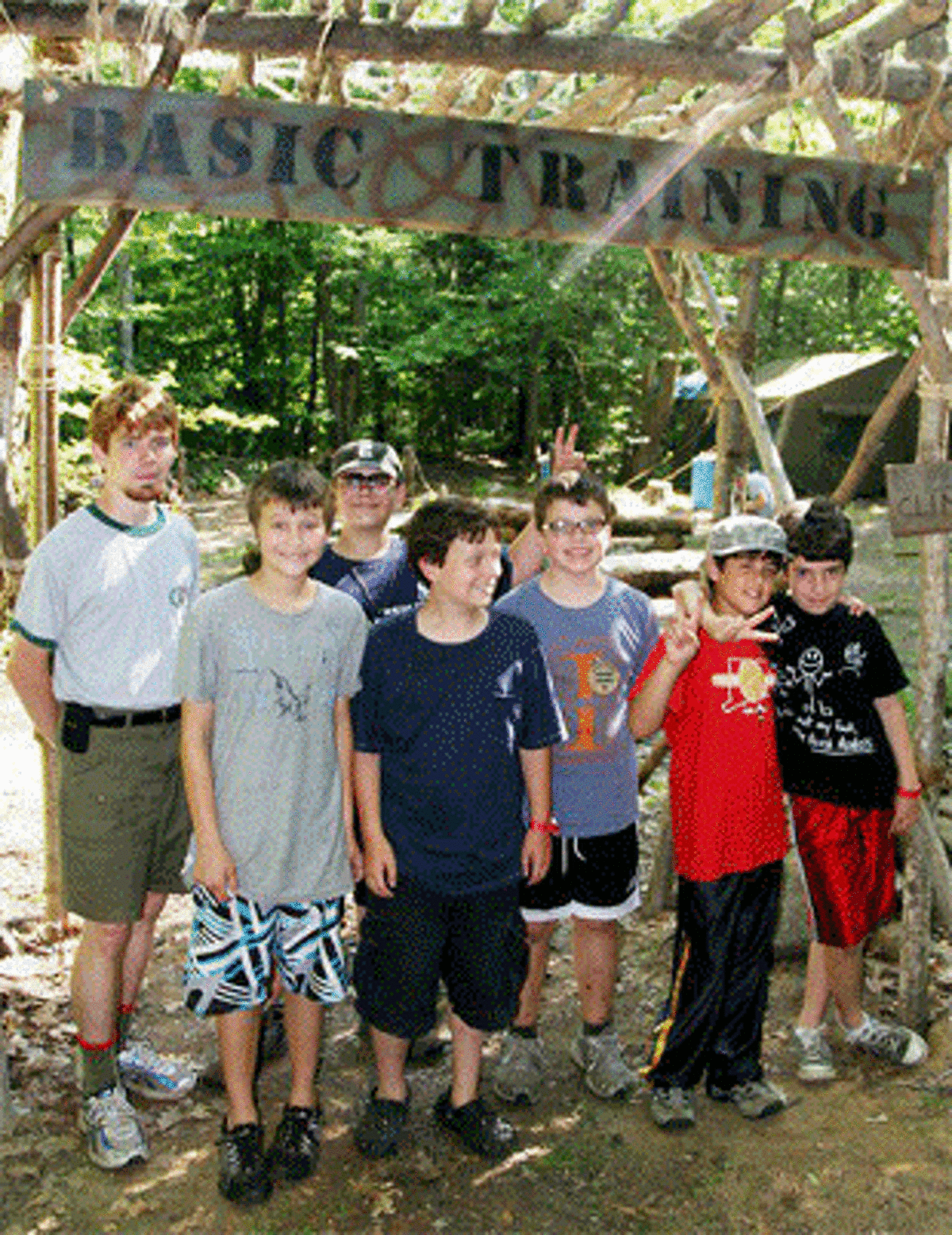 Kyle Casiglio, left, with some campers at the local Boy Scout council’s Edmund D. Strang Scout Reservation in upstate Connecticut.