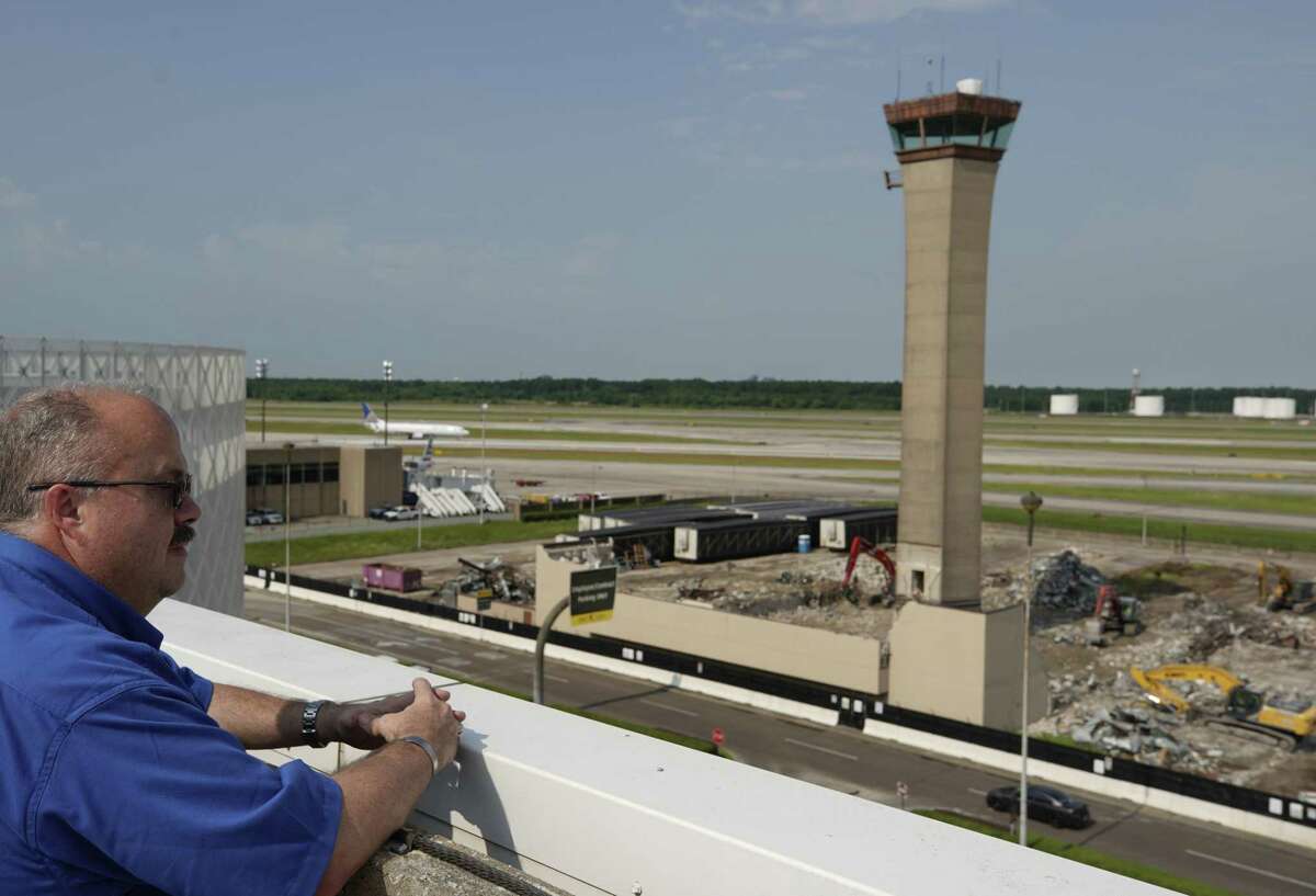 David C. “Hoss” Robertson, an airside operations coordinator, looks at the original traffic control tower at George Bush Intercontinental Airport Thursday, May 30, 2019, in Houston. The control tower was designed by world-renowned architect I.M. Pei. The defunct control tower will remain but the buildings around the control tower are being demolished. He was 5 years old when he attended the airport’s grand opening in June 1969. George Bush Intercontinental Airport was originally called Houston Intercontinental Airport.