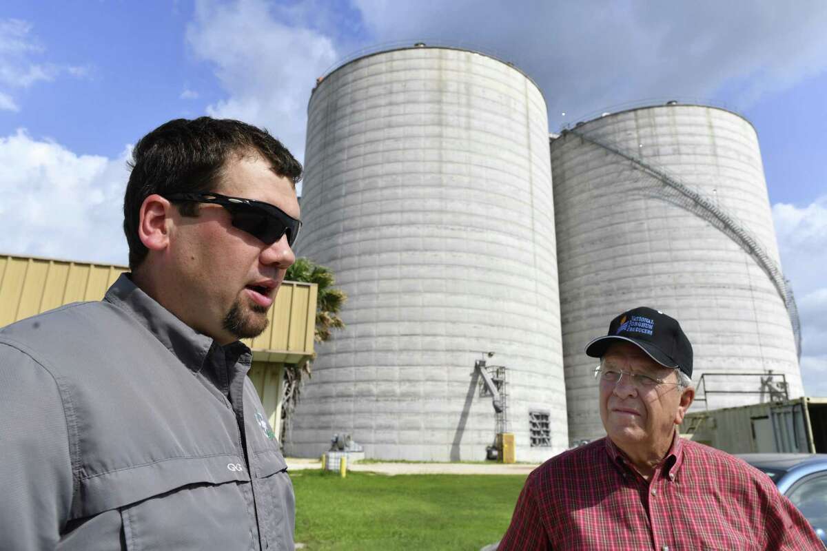 Jason Lee, left, Planter's Co-Op plant manager, speaks with farmer Bobby Nedbalek at the facility, located on Highway 181 west of Taft and east of Sinton. The facility still holds some of last year's sorghum crop. This year's sorghum crop will be harvested starting about late June and early July.