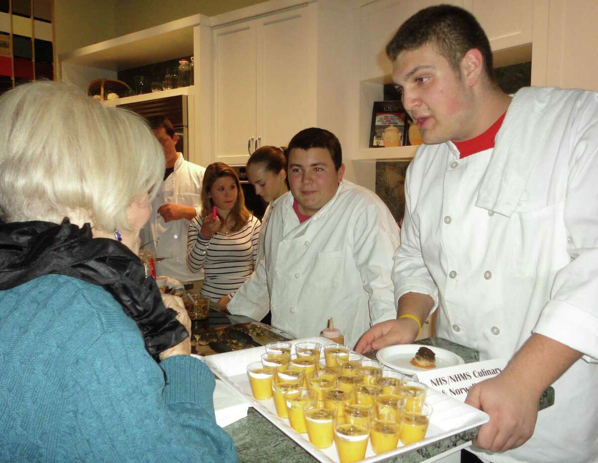 Students from Norwalk High School's culinary arts programs served their own creations at the Norwalk Education Foundation fundraiser and told those who attended that their fare was "garden to table." The culinary arts program will be expanded with the construction of a new classroom and kitchen space.