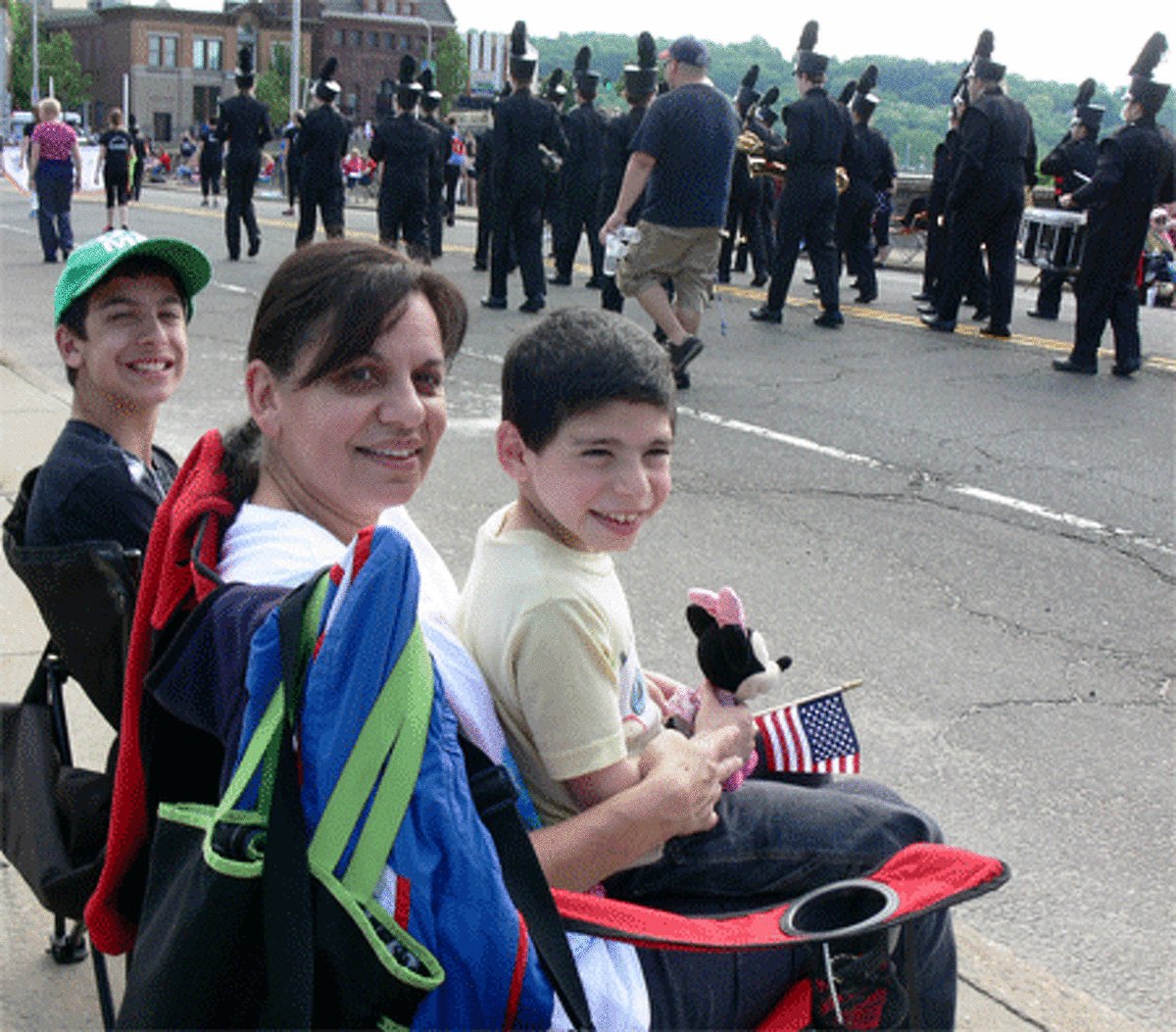 Joanna Ciambriello of Shelton, joined by her sons Michael, 14, left, and Anthony, 7, had a good view of the parade from the bridge.