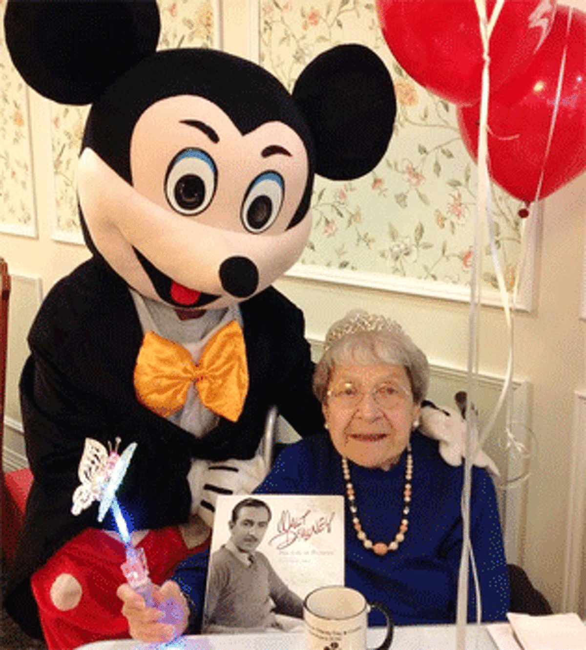 Dorothy Cotton with Mickey Mouse at Crosby Commons in Shelton.