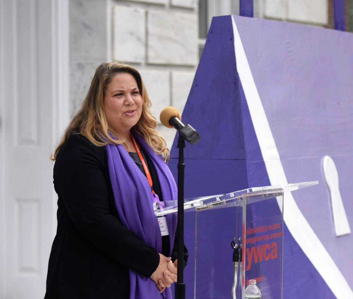 YWCA Greenwich Director of Domestic Abuse Services Meredith Gold speaks during the Domestic Violence Awareness and Prevention Month Kickoff at Town Hall in Greenwich, Conn. Tuesday, Oct. 2, 2018.