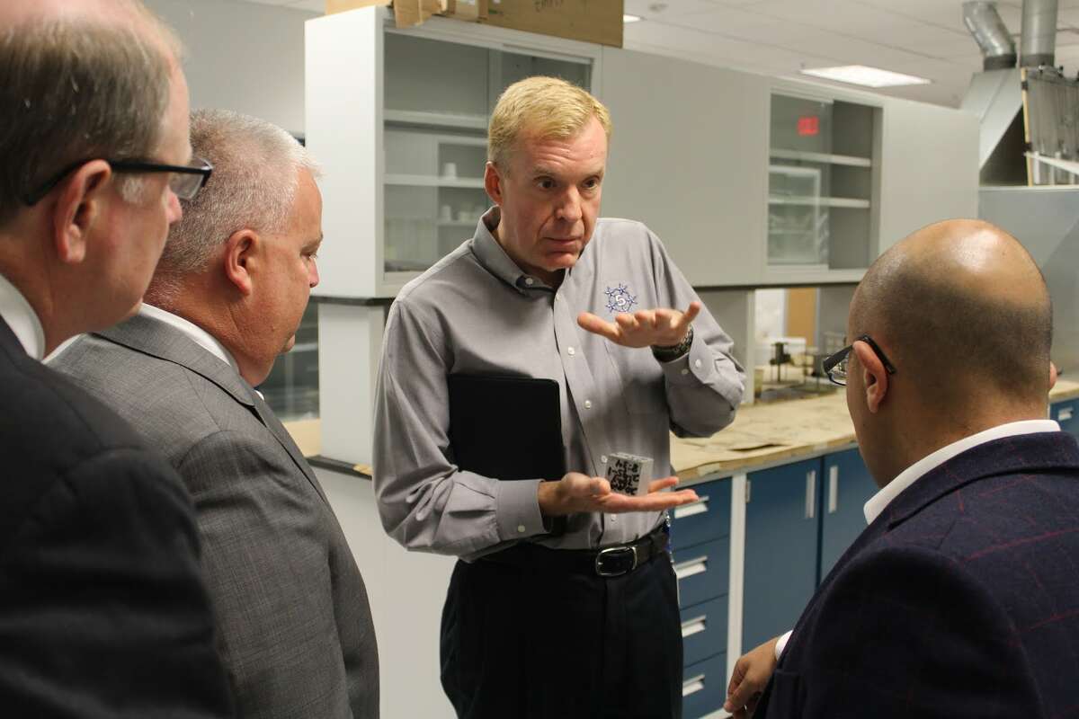 Kelly, McGorty, and Perillo watch as Lupien demonstrated how Five Star’s products handle large amounts of compression. - Aaron Berkowitz photo