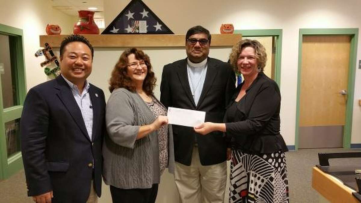 Pictured from left to right: The Rev. InKoo Chung, Huntington United Methodist Church, the Rev. Lucille L. Fritz, Huntington Congregational Church, UCC, the Rev. Amjad Samuel, St. Paul's Episcopal Church, and Susan J. Agamy.
